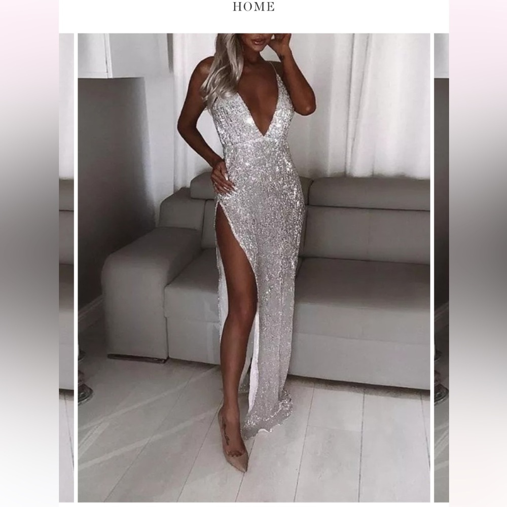 Long silver sparkly prom formal dress with deep plunge neck and high side split.